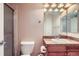 Cozy bathroom featuring a granite countertop, mirrored cabinet, and a shower with glass door at 4500 Baseline Rd # 3101, Boulder, CO 80303