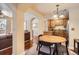 Bright dining area featuring hardwood floors and views into the kitchen and living room at 4500 Baseline Rd # 3101, Boulder, CO 80303