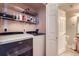 Laundry area with modern washer and dryer, storage shelves, and convenient access to bathroom at 4500 Baseline Rd # 3101, Boulder, CO 80303