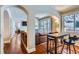 Open-concept living area with wood floors, natural light, and views into the dining area at 4500 Baseline Rd # 3101, Boulder, CO 80303