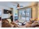 Cozy living room featuring a fireplace and sliding doors to a balcony at 4500 Baseline Rd # 3101, Boulder, CO 80303