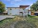 Spacious backyard with deck and patio areas, ready for outdoor entertaining at 12238 Monroe Dr, Thornton, CO 80241