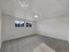 Well-lit basement featuring neutral carpet and windows, offering potential for a comfortable living space at 12238 Monroe Dr, Thornton, CO 80241