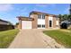 Charming two-story home features brick accents, an attached garage, and a well-maintained front yard at 12238 Monroe Dr, Thornton, CO 80241