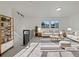 Bright living room with modern decor, sleek furniture, and lots of natural light at 12238 Monroe Dr, Thornton, CO 80241