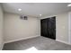 Basement bedroom featuring a large closet with paneled doors and plush carpet flooring at 2202 S Grape St, Denver, CO 80222
