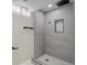 Updated bathroom featuring a tiled shower with a built-in niche at 2202 S Grape St, Denver, CO 80222