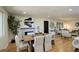Elegant dining area with a fireplace, wooden table, and bright, neutral decor at 2202 S Grape St, Denver, CO 80222