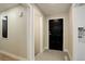 Inviting entryway with a black door, tiled floor, and neutral-colored walls at 2202 S Grape St, Denver, CO 80222