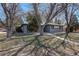 Charming single-story home with mature trees and a well-maintained front yard at 2202 S Grape St, Denver, CO 80222