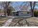 Lovely single-story brick home featuring a welcoming walkway and mature trees enhancing its curb appeal at 2202 S Grape St, Denver, CO 80222