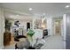 Open-concept kitchen with stainless steel appliances and an adjoining dining area at 2202 S Grape St, Denver, CO 80222