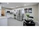 Recently updated kitchen with stainless steel appliances, white cabinetry and room for dining at 2202 S Grape St, Denver, CO 80222