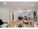 Spacious living area showcasing an open floor plan with hardwood flooring, neutral walls, and a stylish kitchen at 2202 S Grape St, Denver, CO 80222