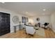 An elegant living room featuring an art wall design, hard wood floors, neutral walls, and modern furniture at 2202 S Grape St, Denver, CO 80222