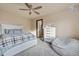 Bedroom with ceiling fan and comfy seating area at 11208 Eagle Creek Cir, Commerce City, CO 80022