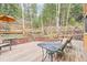Cozy back deck with views of trees and rock terraces at 13314 Spruce Creek Cir, Larkspur, CO 80118