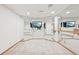 Spacious carpeted basement featuring mirrored walls, ballet bar, and wall-mounted TVs at 13314 Spruce Creek Cir, Larkspur, CO 80118