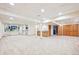 Spacious basement with carpet, bar area, and a view to a closet at 13314 Spruce Creek Cir, Larkspur, CO 80118