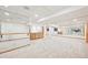 Finished basement boasting mirrored wall, wooden ballet bar, and custom built-in cabinetry at 13314 Spruce Creek Cir, Larkspur, CO 80118