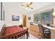 Bedroom featuring a large window, desk, and a wooden bed at 13314 Spruce Creek Cir, Larkspur, CO 80118