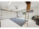 Spacious two car garage features natural light and a loft access ladder at 13314 Spruce Creek Cir, Larkspur, CO 80118