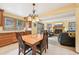 Open concept kitchen with a wooden table and chairs at 13314 Spruce Creek Cir, Larkspur, CO 80118