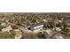 Aerial view of neighborhood showcasing modern townhouses nestled among mature trees at 1678 Tabor St, Lakewood, CO 80215