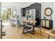 Open kitchen and dining area featuring modern lighting, an island, and stainless steel appliances at 1678 Tabor St, Lakewood, CO 80215