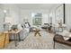 Bright living room featuring modern decor, hardwood floors, and ample natural light at 1678 Tabor St, Lakewood, CO 80215