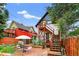 Backyard with patio, wooden planter beds and a dining table with umbrella at 274 S Lincoln St, Denver, CO 80209