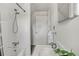 Bright bathroom showcases a shower/tub combo, tiled walls, and vanity sink at 274 S Lincoln St, Denver, CO 80209