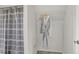 Bathroom includes a shower with patterned curtain, robe, and tile floor at 274 S Lincoln St, Denver, CO 80209