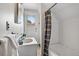 Cozy bathroom is equipped with a shower/tub combination and white vanity at 274 S Lincoln St, Denver, CO 80209