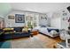 Bright bedroom with hardwood floors, natural light, and sofa at 274 S Lincoln St, Denver, CO 80209