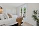 Bright bedroom with fresh white walls and a view to the outdoors at 274 S Lincoln St, Denver, CO 80209