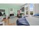 Bedroom featuring hardwood floors, closet, and comfortable sitting area at 274 S Lincoln St, Denver, CO 80209