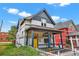 Attractive home exterior with a well-maintained yard, inviting porch, and charming architectural details at 274 S Lincoln St, Denver, CO 80209