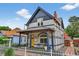 Beautiful exterior view showcasing the home's architecture, landscaped yard, and inviting front porch at 274 S Lincoln St, Denver, CO 80209
