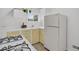 Charming kitchen with stove, white appliances, bright cabinets, and ample counter space at 274 S Lincoln St, Denver, CO 80209