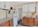 Cozy kitchen featuring white cabinets, stainless steel sink, and granite countertops at 274 S Lincoln St, Denver, CO 80209