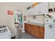 Bright kitchen with tile floor, arched entrance, and oak cabinets at 274 S Lincoln St, Denver, CO 80209