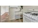 Well-lit kitchen features modern appliances, display shelving, and tiled floors at 274 S Lincoln St, Denver, CO 80209