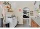 Eat-in kitchen with modern appliances and arched entrance to the living room at 274 S Lincoln St, Denver, CO 80209