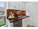 Updated kitchen with dark countertops and a view to the backyard at 274 S Lincoln St, Denver, CO 80209