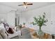 Bright living room with glass table, stylish seating, and a green plant as decor at 274 S Lincoln St, Denver, CO 80209
