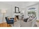 Cozy living room with a stone fireplace, hardwood floors, and a beautiful stained glass window at 274 S Lincoln St, Denver, CO 80209