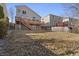 A spacious backyard featuring a deck, patio, and fenced yard at 20781 E 48Th Pl, Denver, CO 80249