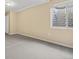 Unfinished basement room with wall to wall carpet and a window at 20781 E 48Th Pl, Denver, CO 80249