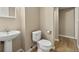 Cozy bathroom with hardwood floors, updated vanity, and neutral paint at 20781 E 48Th Pl, Denver, CO 80249